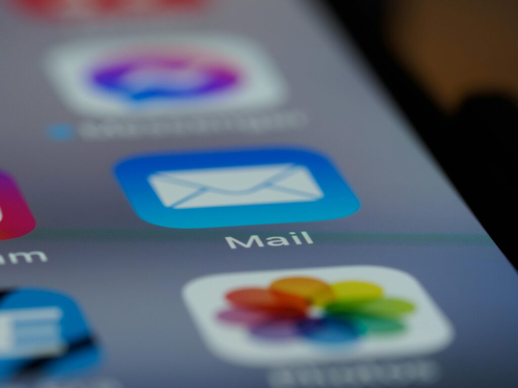 Detailed close-up of an email app icon on a smartphone screen, showcasing modern technology.